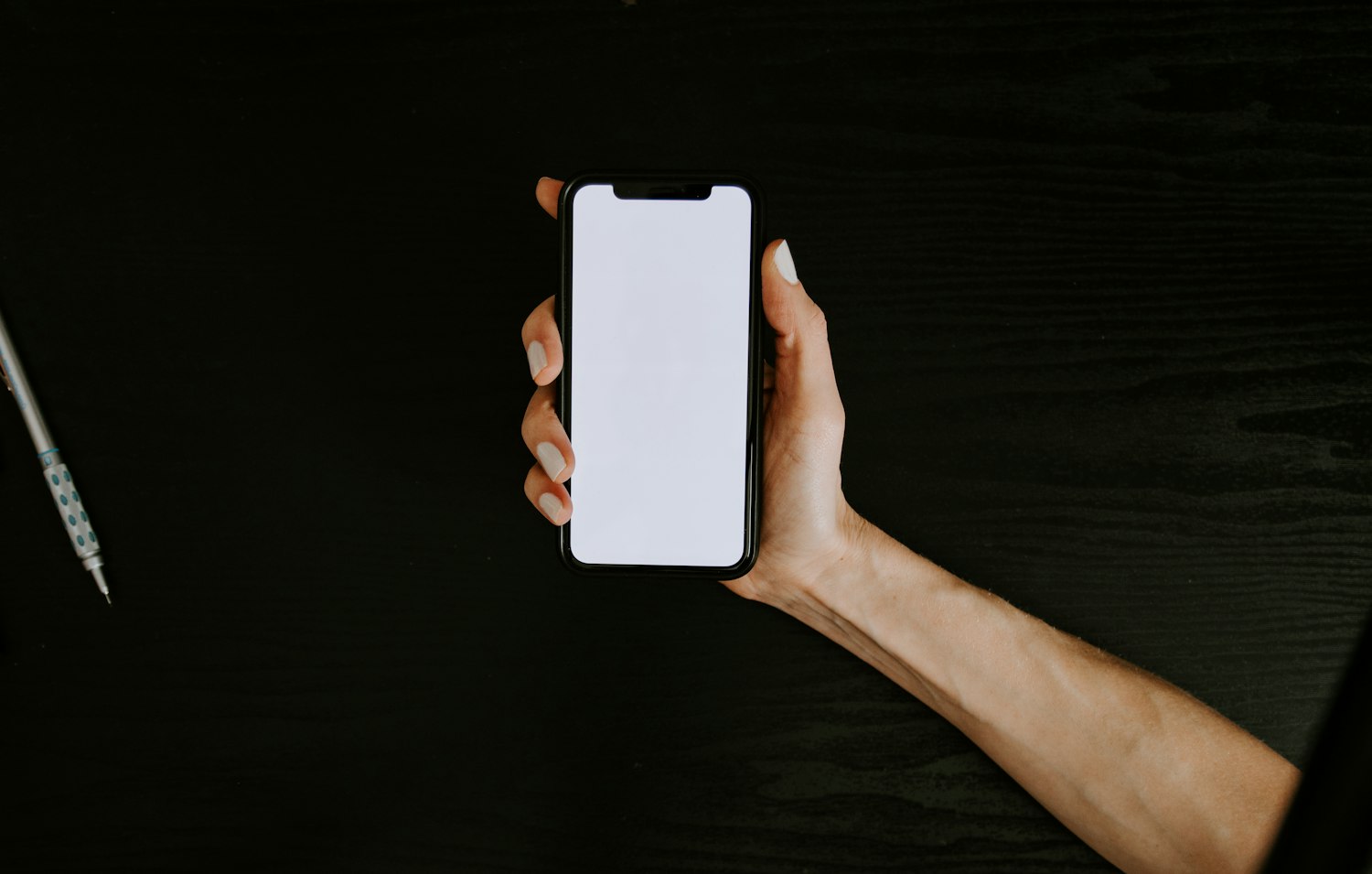 An iPhone in the hand of the person the app is for