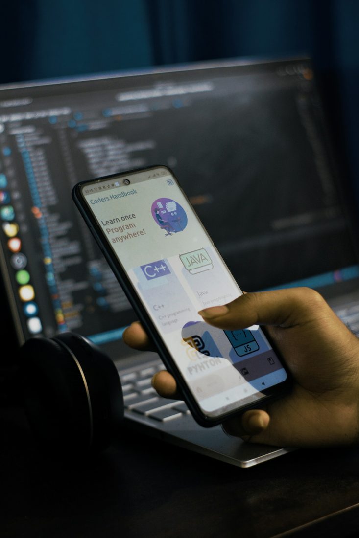 A developer testing an app on a phone