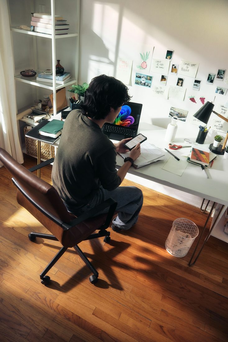 Someone working from a home office desk