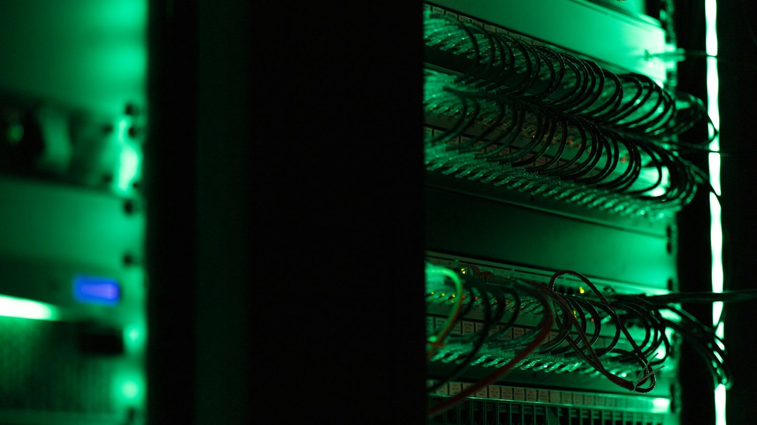 A server rack lit by status lights