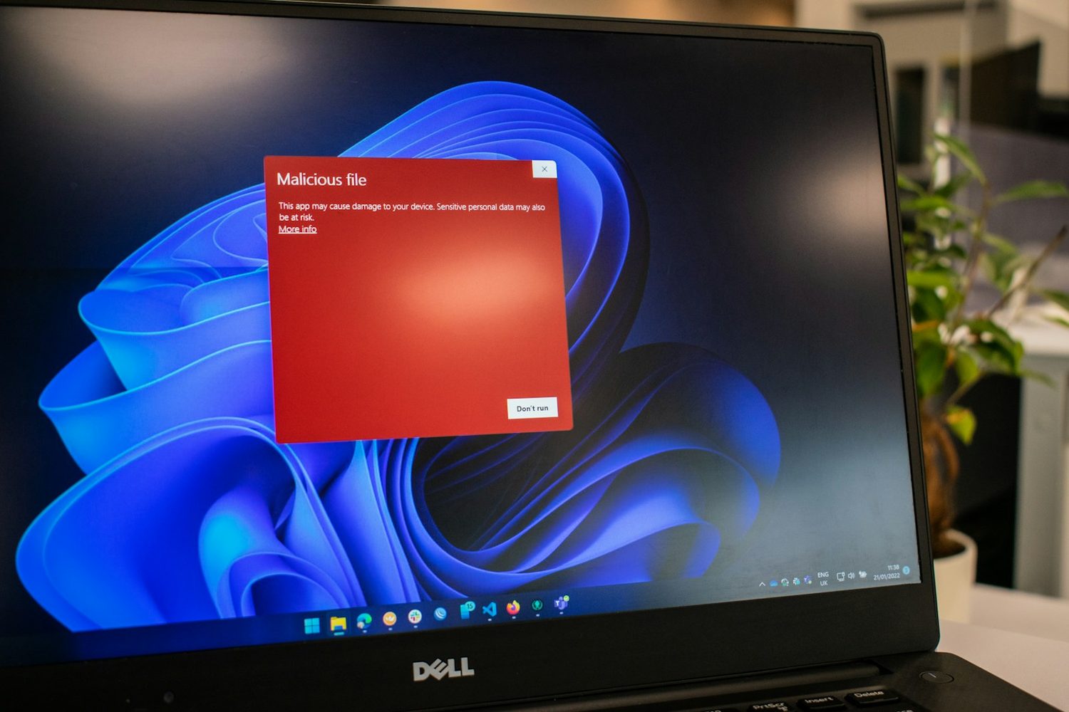 A malicious file warning on a Windows laptop