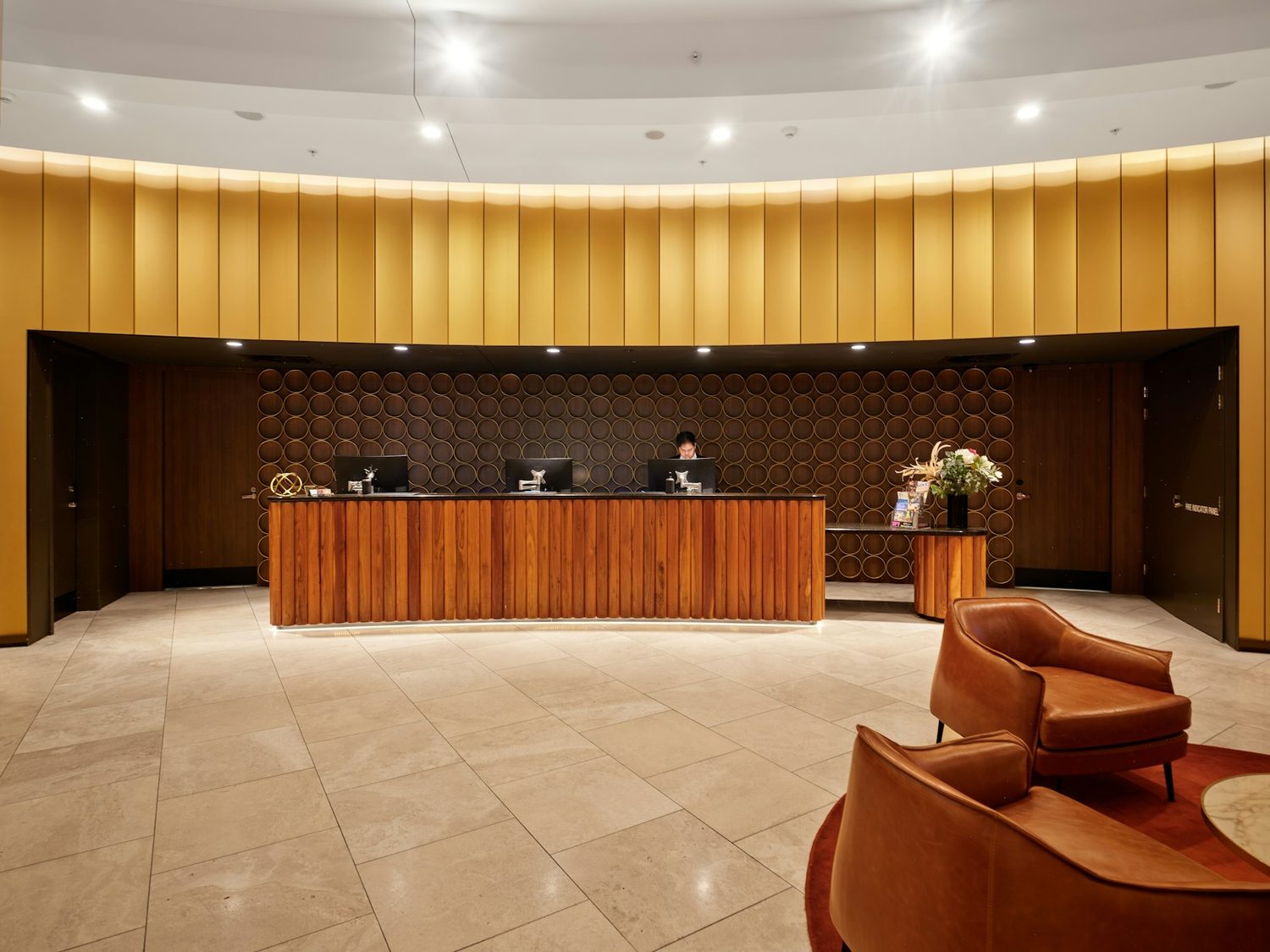 The reception desk and lounge of a hotel lobby